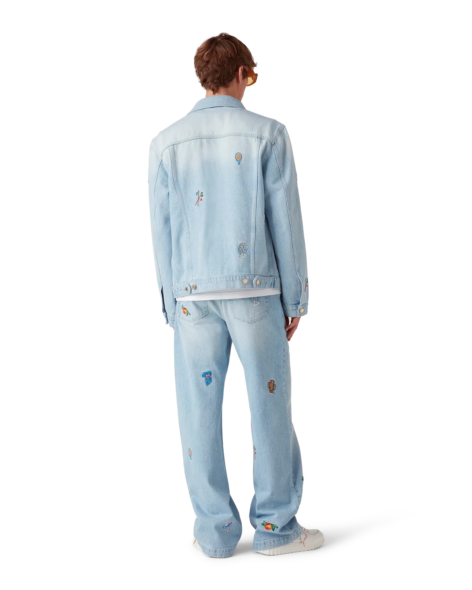 Model wearing Light Vintage Wash Embroidered Motif Jeans paired with coordinating embroidered denim jacket