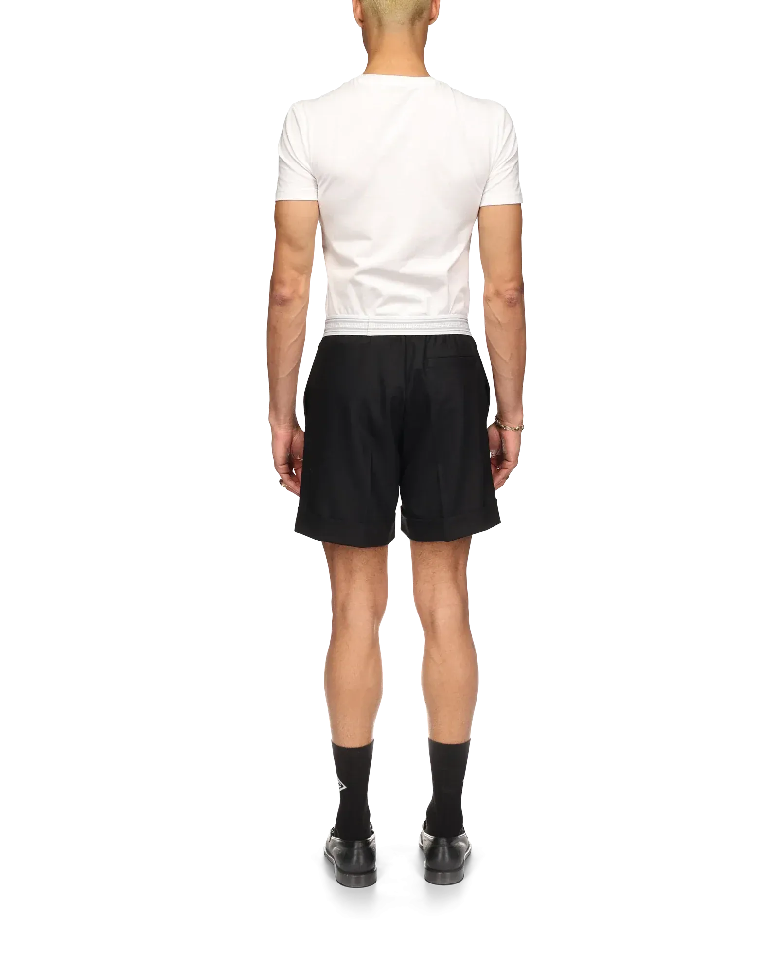 Model wearing black sports tailoring shorts with tailored top