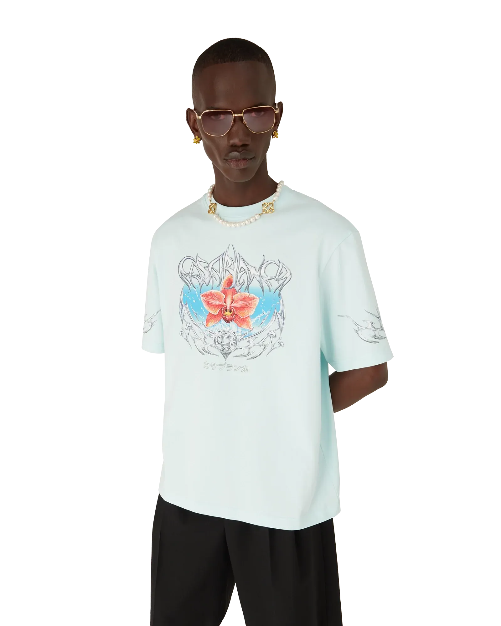 Male model styled in Casablanca Blades Oversized Short Sleeve T-Shirt in pale blue organic cotton